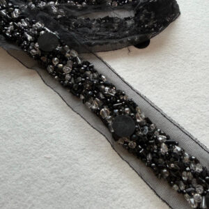 monochromatic black on black beaded ribbon for avant garde couture