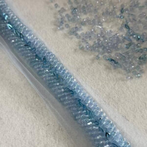 couture geometric chandelier ribbon border with metallic bugle crosses