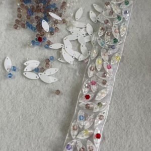 couture geometric chandelier ribbon border with metallic bugle crosses